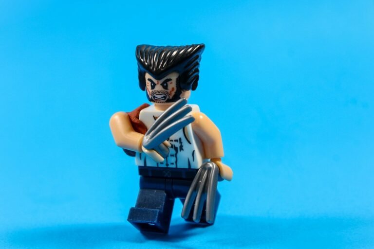 Wolverine lego figure with claws extended on blue background